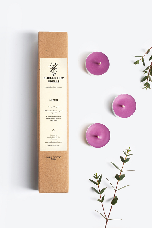 Scented tealight candles MIMIR with lavender, sandalwood, and opium aromas, presented in eco-friendly packaging alongside eucalyptus sprigs.