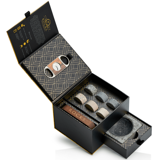Whiskey stones gift set with granite stones, cigar cutter, and ashtray in gold foil box