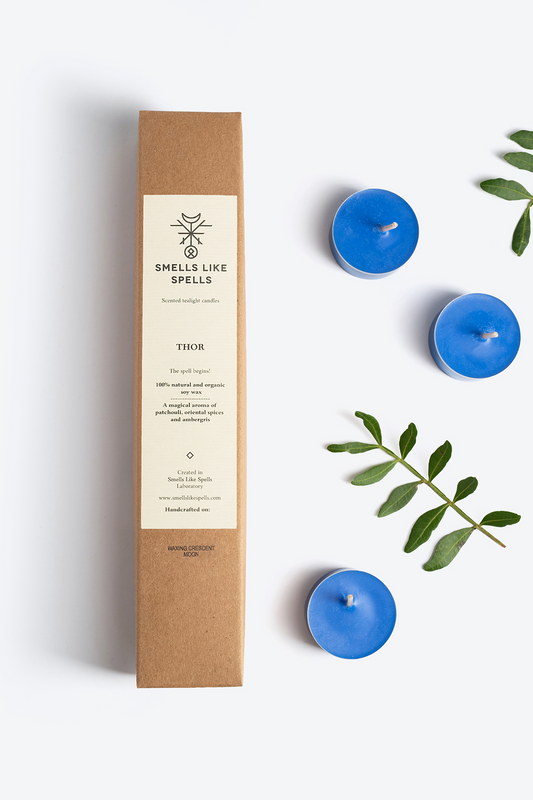Scented tealight candles THOR with patchouli, oriental spices, and ambergris in eco-friendly packaging and blue wax candles.