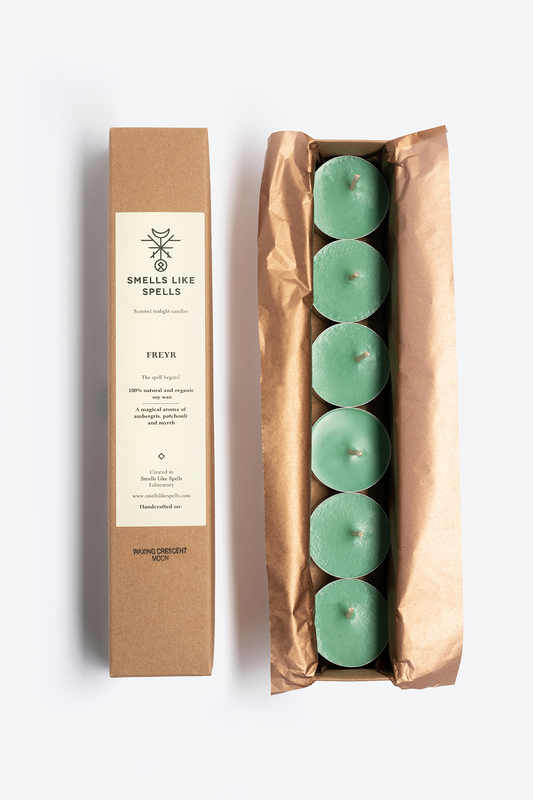 Pack of six green scented tealight candles FREYR with packaging highlighting natural soy wax and aromatic properties.