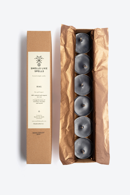 Scented tealight candles set with juniper, rosemary, and myrrh aromas in eco-friendly packaging for aromatherapy and energy cleansing.