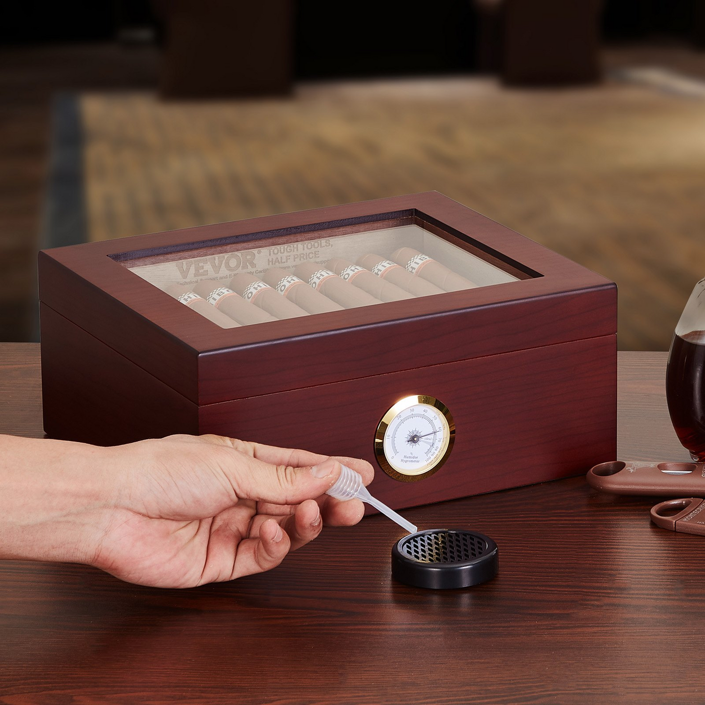 VEVOR 50 cigars humidor with glass top, cedar wood storage box, built-in hygrometer and humidifier, hand applying moisture, elegant cigar storage accessory