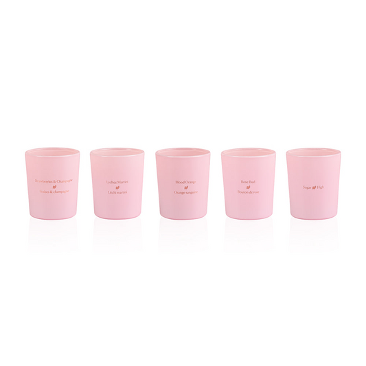 HighOnLove Mini Sensual Massage Candles collection of five pink soy candles with scented massage oils including Strawberries & Champagne, Lychee Martini, Blood Orange, Rose Bud, and Sugar High